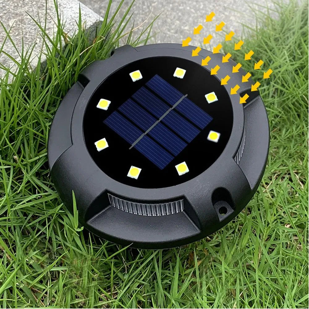 Black LED solar underground lawn light with seven colour cold white light, 11x4x13cm