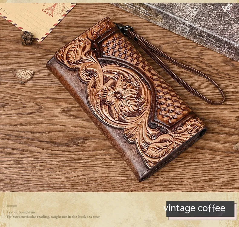 Women's embossed floral tri-fold leather wallet in retro brown colour showing cowhide texture and organisational compartments.