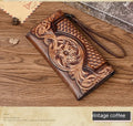 Women's embossed floral tri-fold leather wallet in retro brown colour showing cowhide texture and organisational compartments.