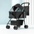 Black metal pet cart with removable wheels in folded position showing one-click folding mechanism
