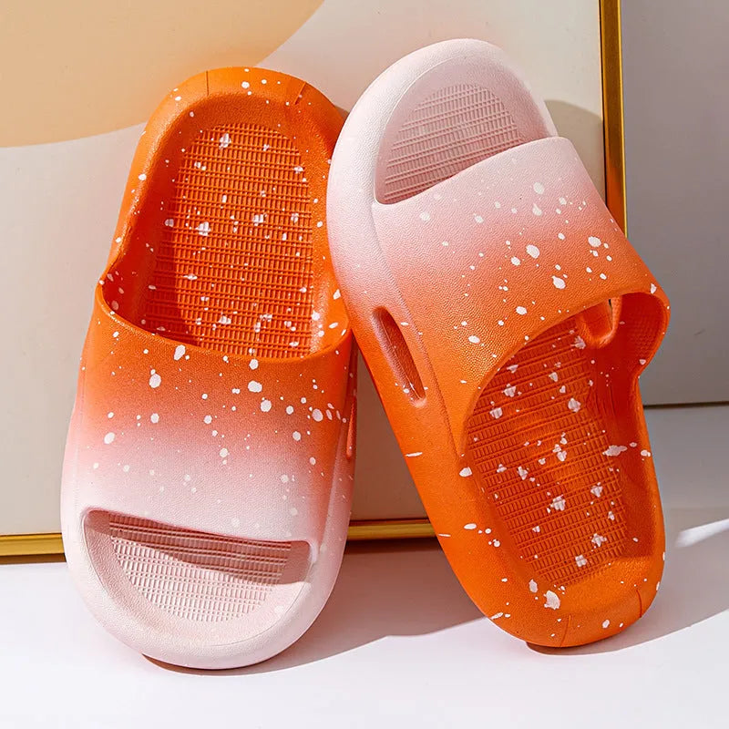 Gradient coloured PVC summer slippers for children on a plain background, showing the non-slip sole.