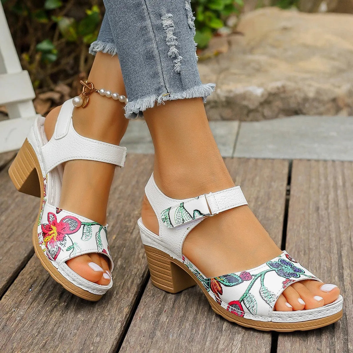 White women's high heel sandals with velcro buckle closure showing PU leather upper and rubber sole