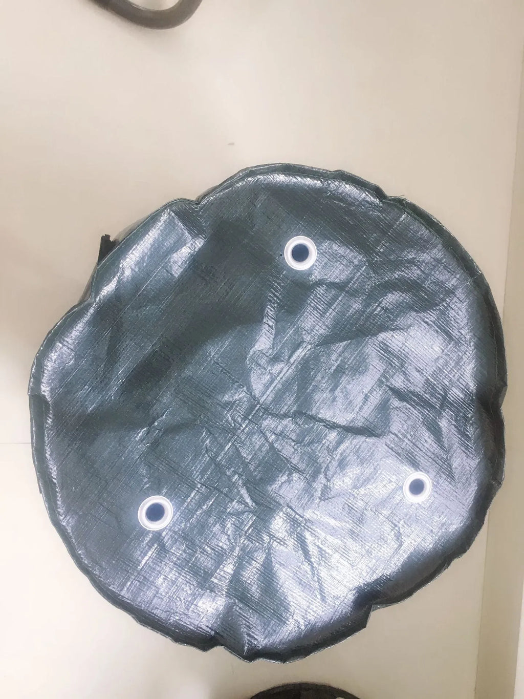 Dark green PE cloth planting bag with side windows and double handles, 34x35cm, for growing potatoes on a balcony.