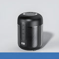 Black portable wireless Bluetooth speaker showing front grille and compact size.