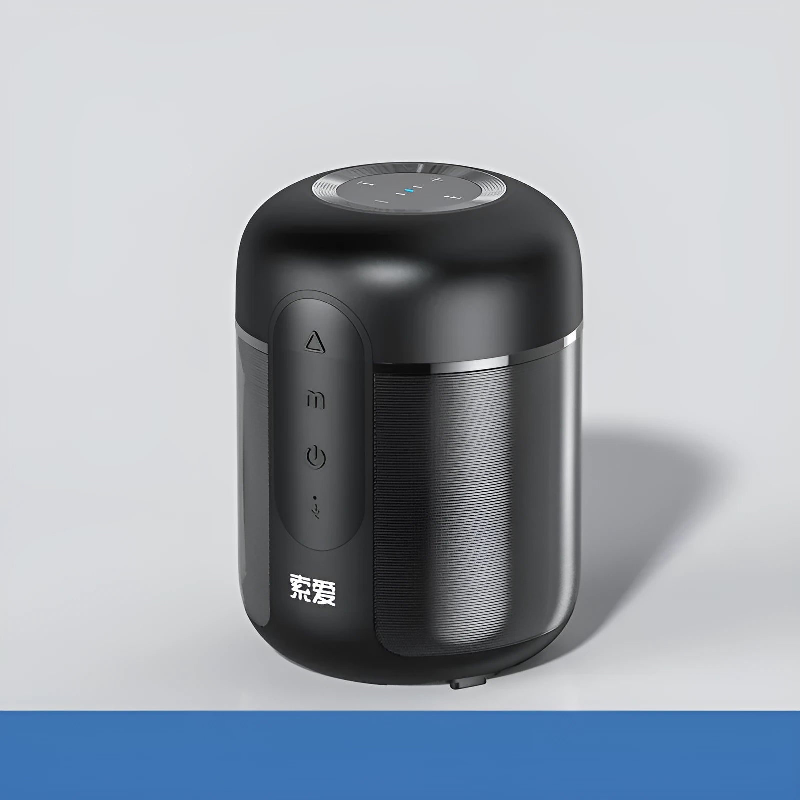 Black portable wireless Bluetooth speaker showing front grille and compact size.