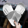 Women's grey blue buckle flip-flop sandals with a soft EVA sole on a plain background