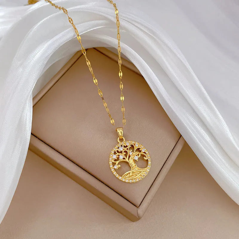 Gold-coloured adjustable necklace with a mother of pearl and rhinestone cross pendant on a lip chain.