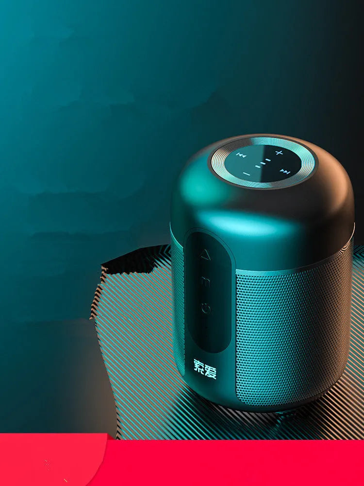 Black portable wireless Bluetooth speaker showing front grille and compact size.