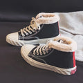 Women's black canvas high top trainers with animal print, cotton lining, buckle fastening and flat rubber sole, sizes 35-40