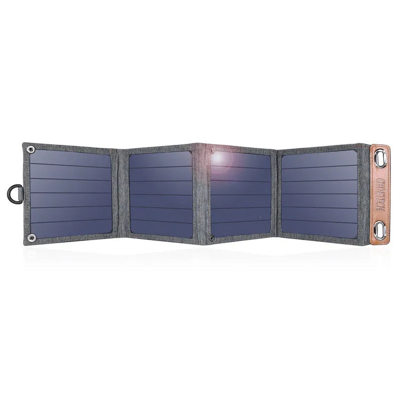 Grey foldable solar charger with USB port for mobile phone and tablet charging outdoors