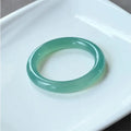 Natural agate wide tire bracelet shown in various colours including pink, blue, green and white agate.
