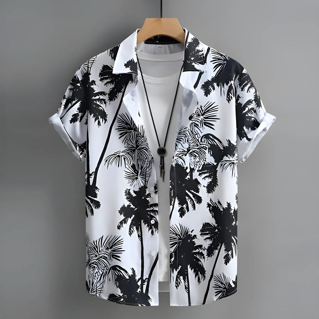 Man wearing a short-sleeved Hawaiian shirt with a colourful 3D printed pattern, suitable for casual summer wear.