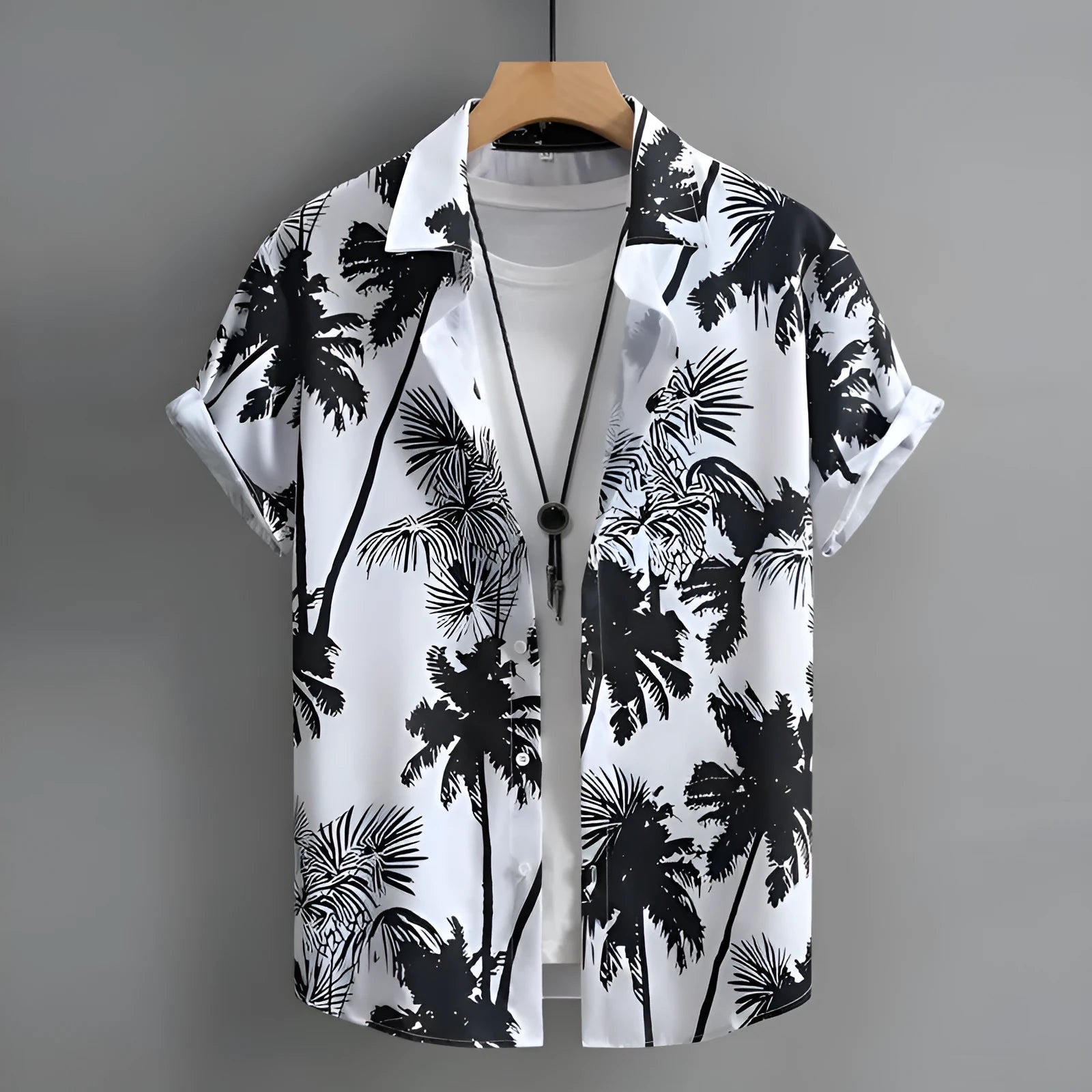 Man wearing a short-sleeved Hawaiian shirt with a colourful 3D printed pattern, suitable for casual summer wear.