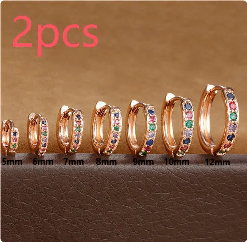 Circle zircon perforated stud earrings in gold, rose gold, and silver colours with geometric design