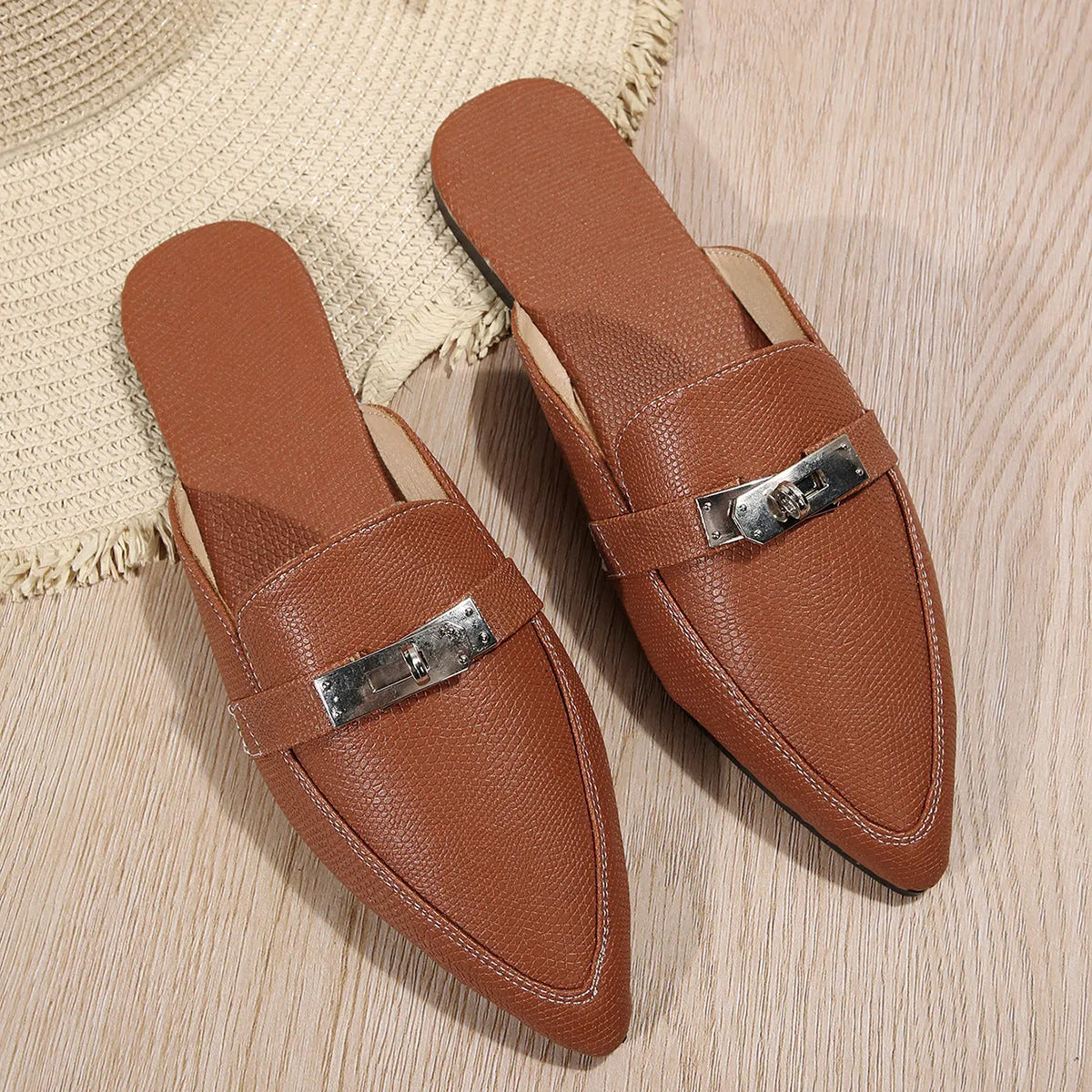 Light brown women's pointed-toe low heel semi-slippers with a PU upper and rubber sole.