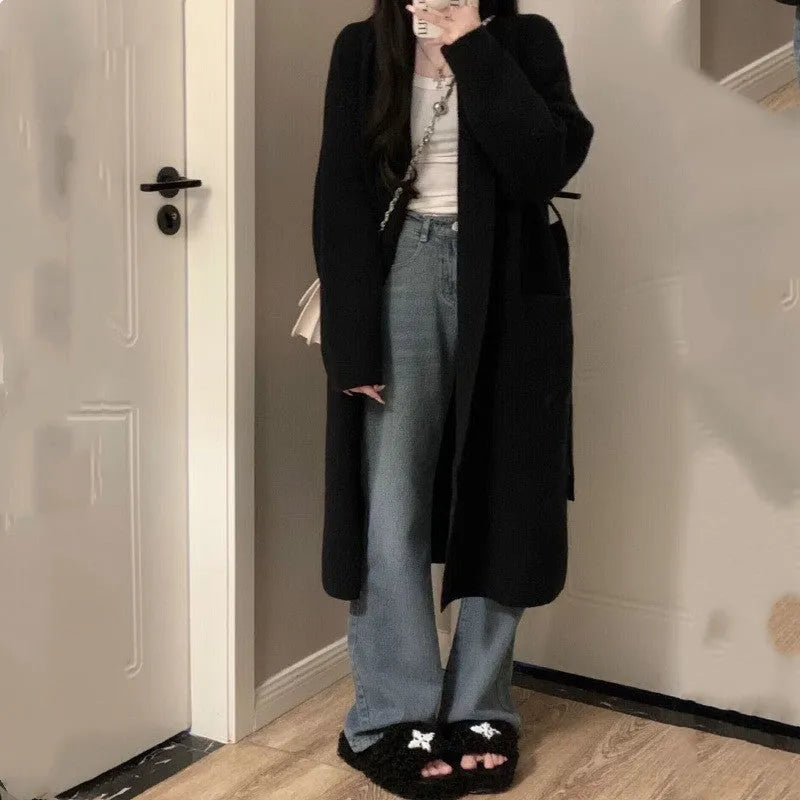 Loose large knitted cardigan for women in thick chenille fabric, shown in dark gray colour.