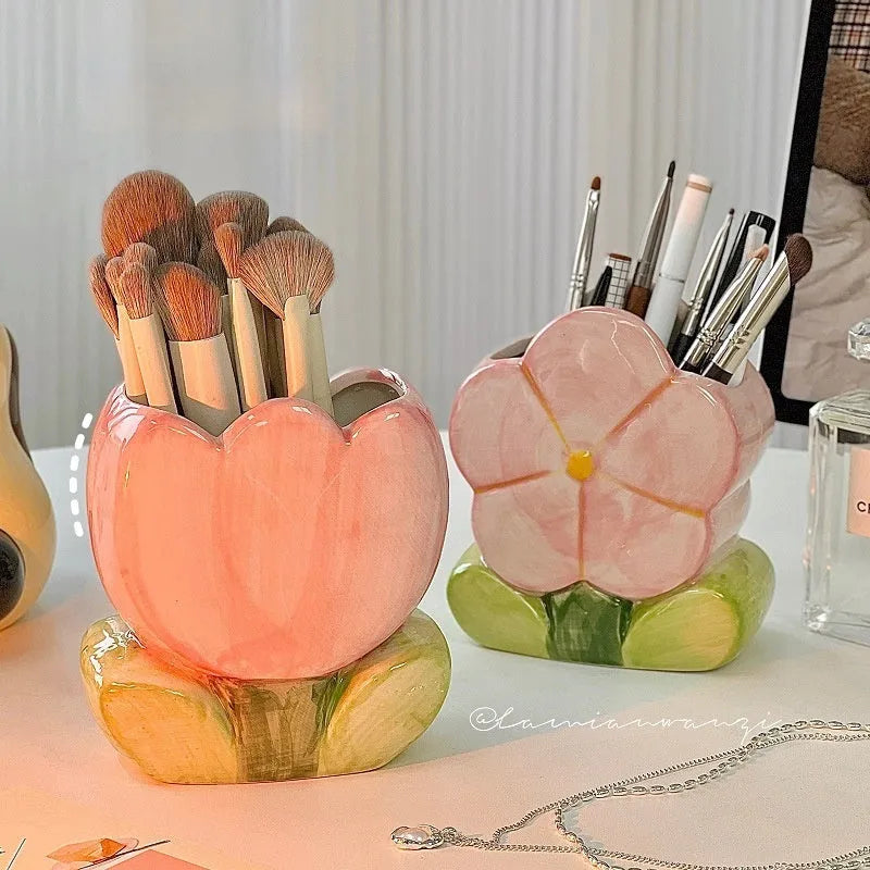 Ceramic floral pen holder storage box with pink tulip design on desktop