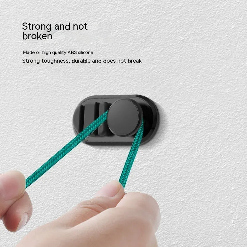 Car data cable storage hook in dark green with adhesive mount for vehicle interiors