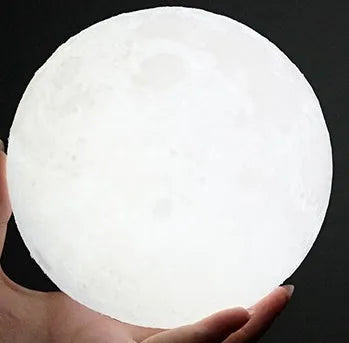 3D printed moon lamp showing detailed craters, with a touch metal ring at base for colour changing and dimming control.