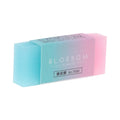 Close-up of a translucent coloured pencil rubber eraser, 4.8cm length, soft edges, for school and art use