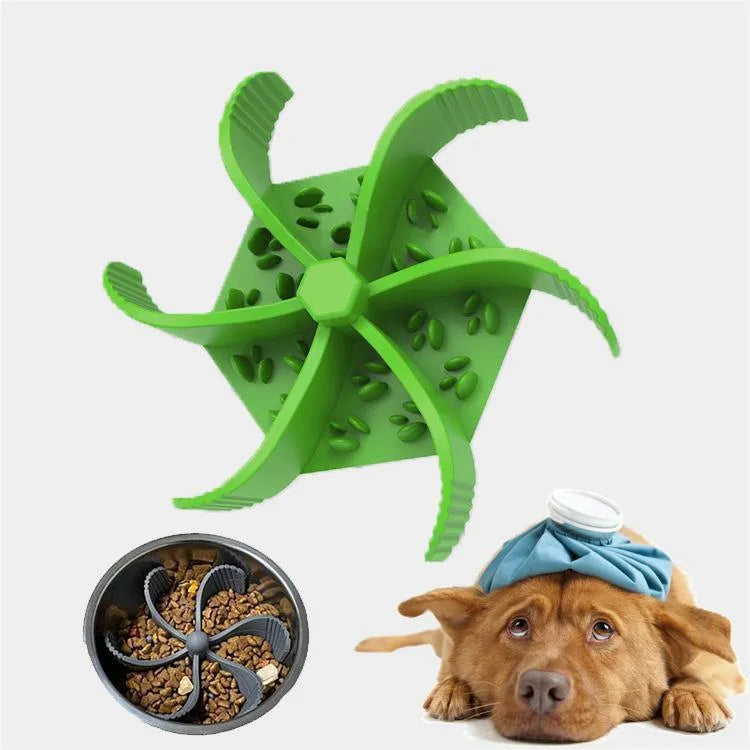 Silicone pet slow food device with sucker cup in green colour on a smooth floor