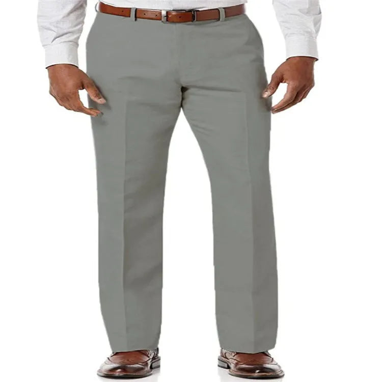 Men's solid colour linen cotton casual trousers with slant pockets laid flat.