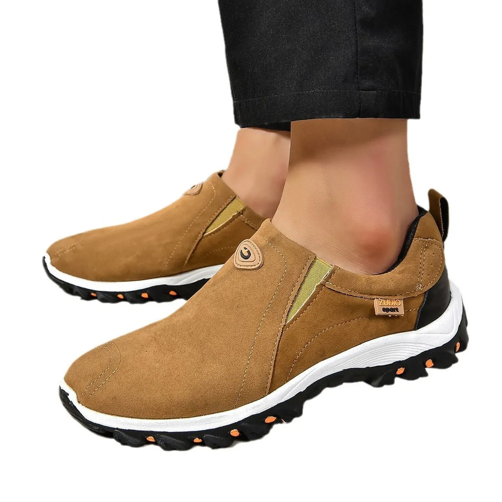 Men's grey round head overshoe cover with rubber sole, shown from the side.