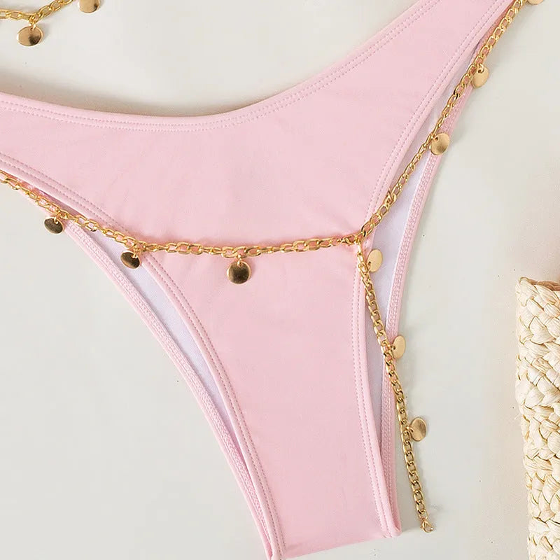 Women's solid colour bikini set in grass green, showing bra top and panty bottom on a plain background