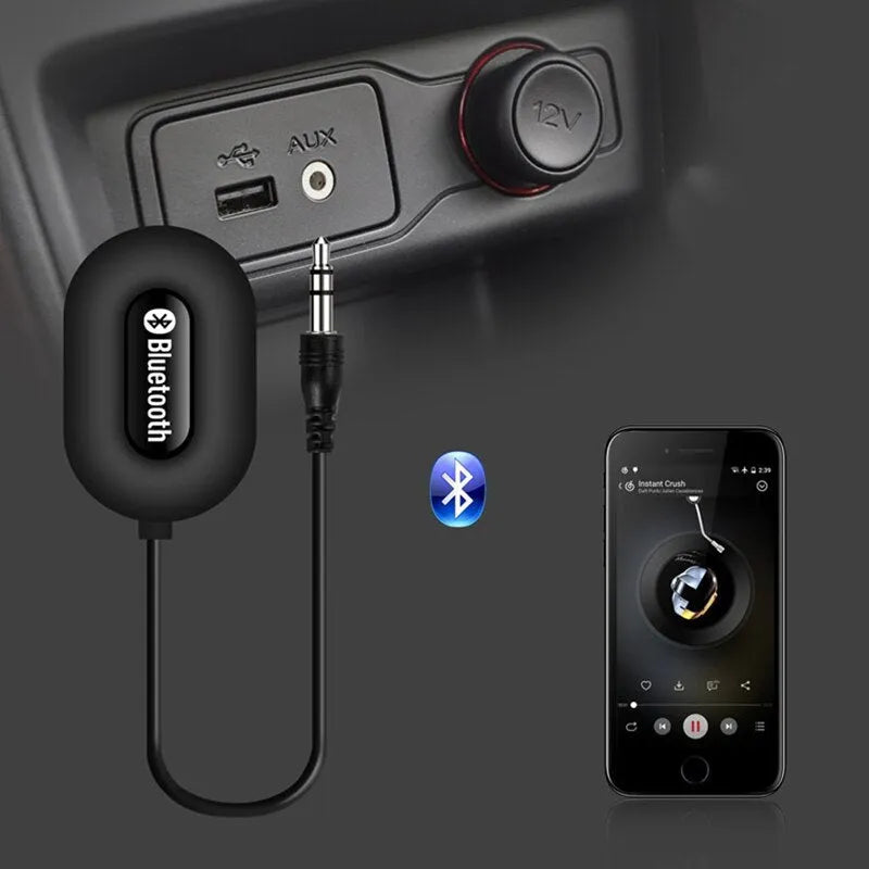 Black B5 Bluetooth music receiver with 3.5mm audio cable and USB charging cable