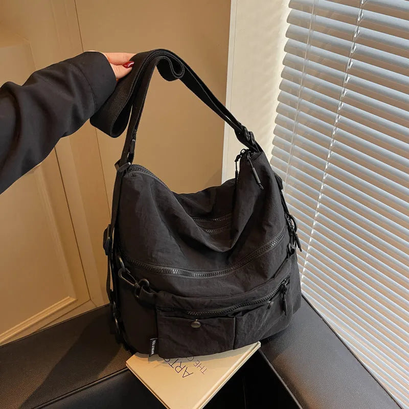 Women's nylon crossbody bag with adjustable strap and external pocket in khaki colour