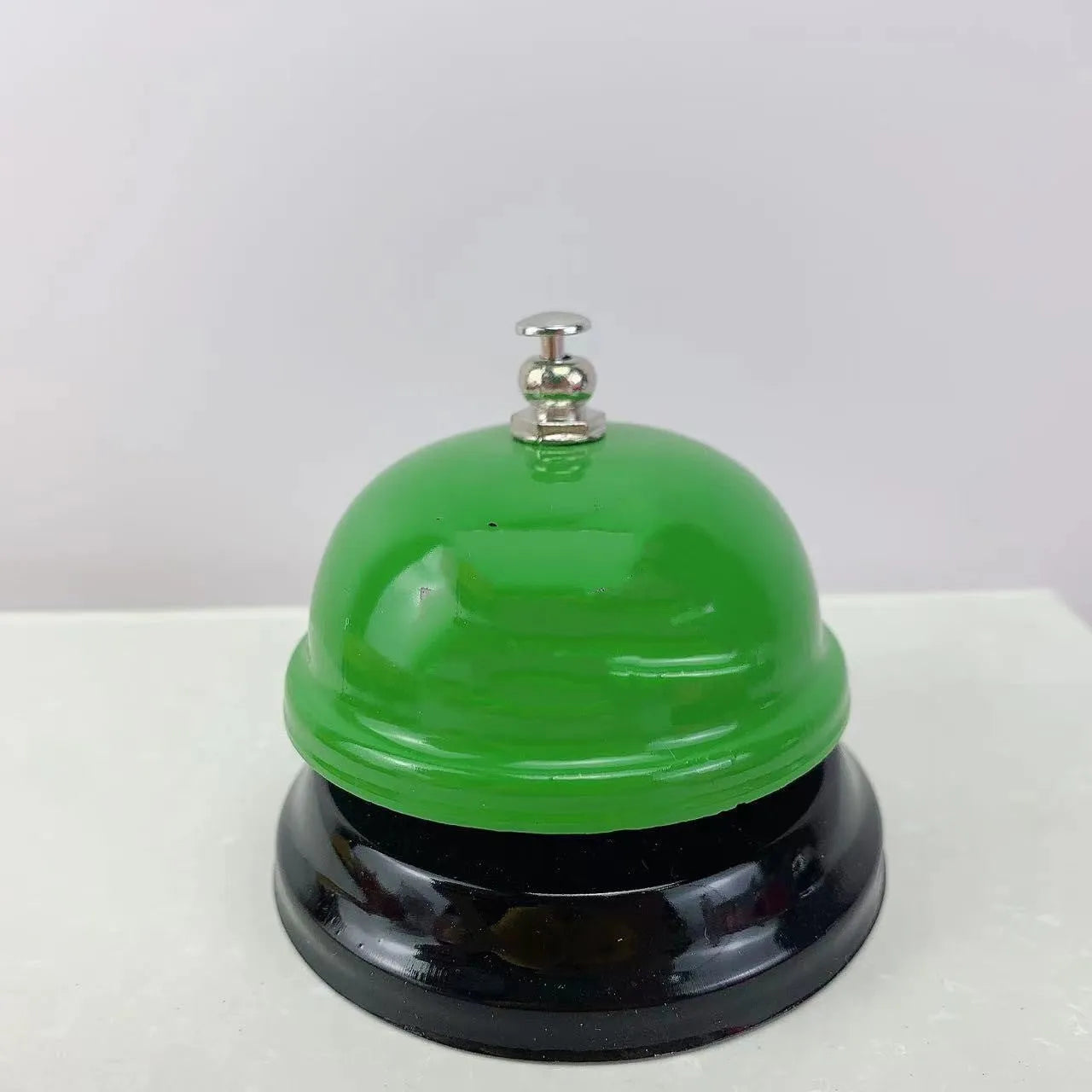 Iron handheld bell in selected colour for classroom games or restaurant service.