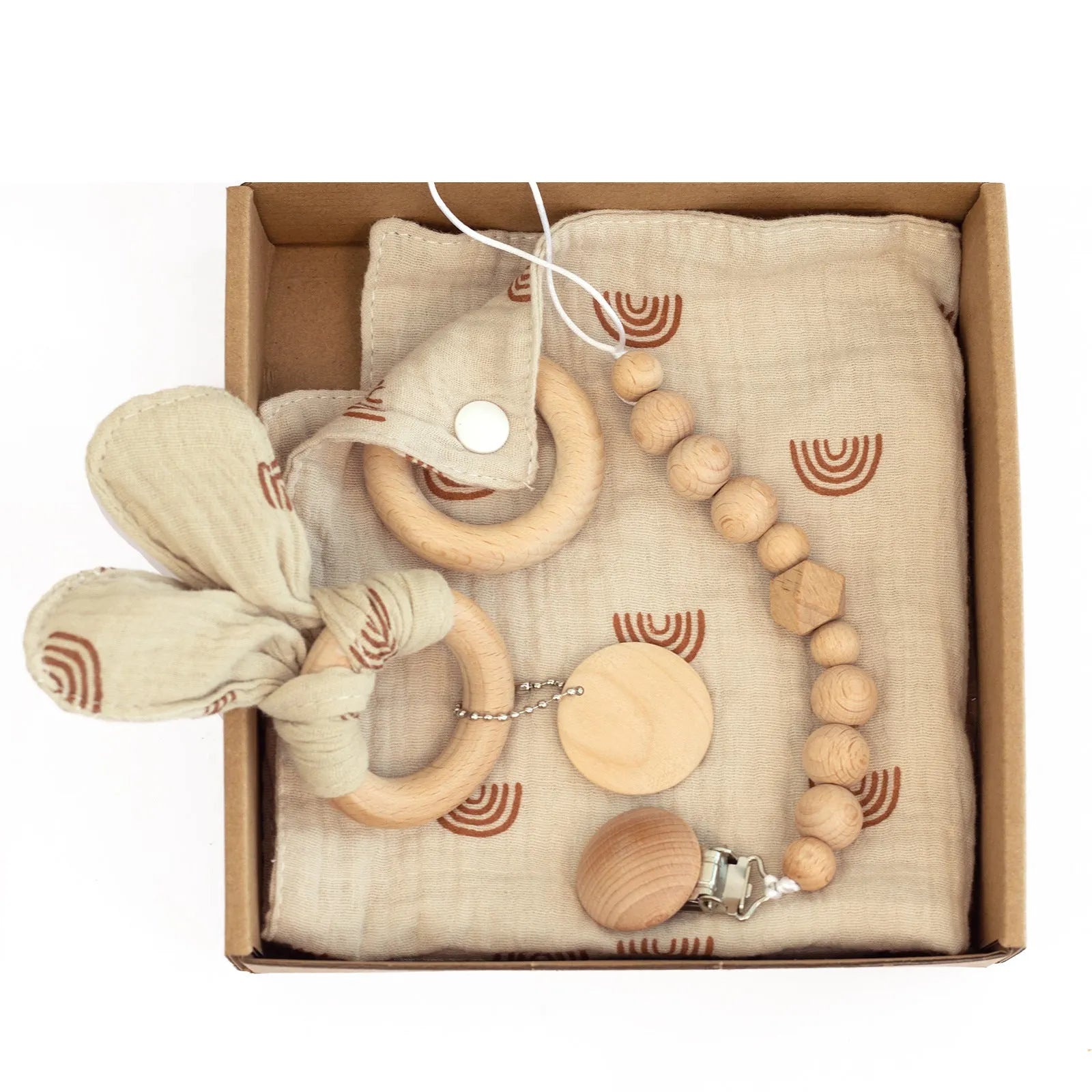 Baby teething toy gift set with bamboo blend gauze blanket, wooden beech bell, teether, brush, and milestone marker.
