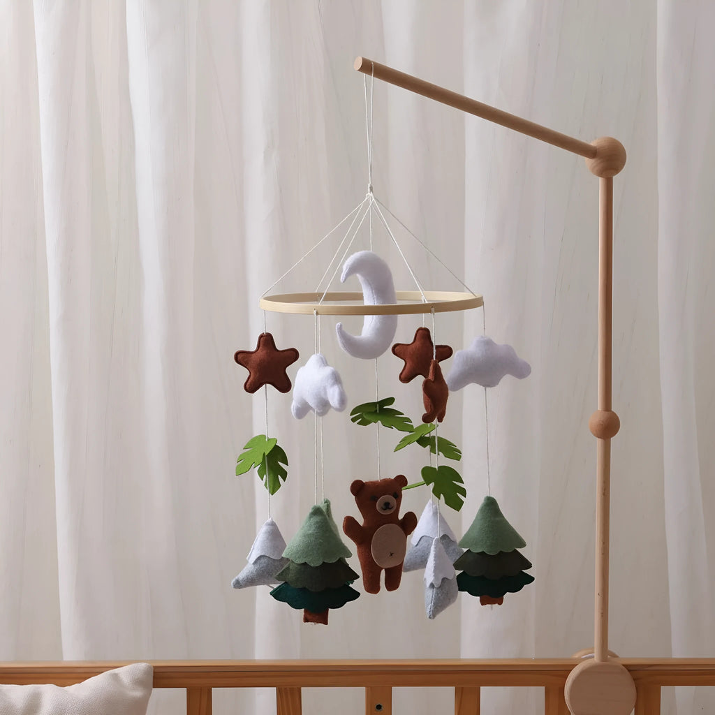 Handmade felt teddy bear bed bell in white on a wooden base for children's soothing sleep