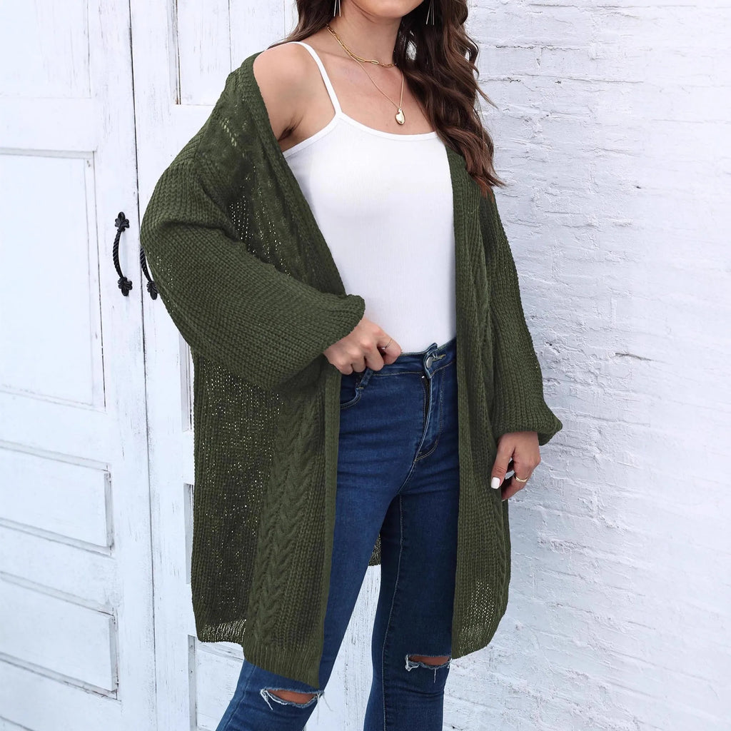 Loose-fitting women's acrylic sweater coat in a solid colour, shown on a model.