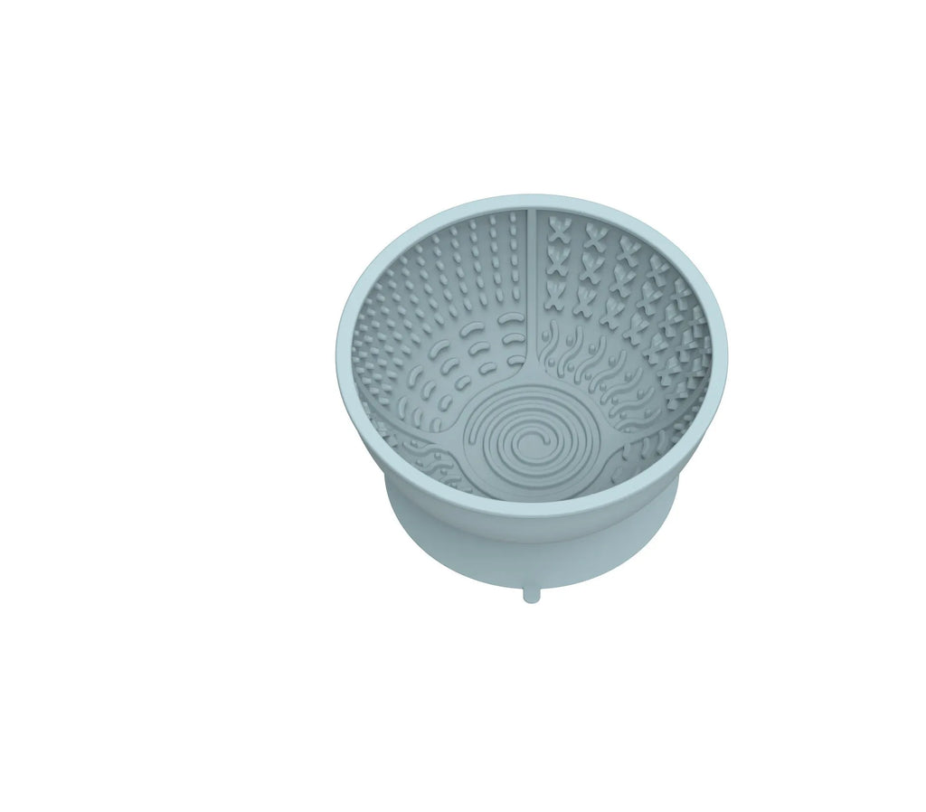 Blue silicone pet slow feeder bowl with textured lick mat surface and suction cup base