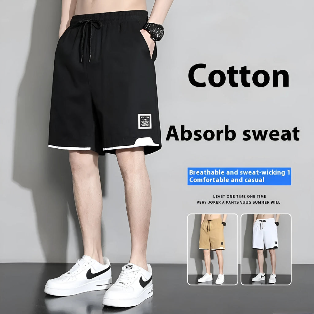 Boys' black cotton casual shorts with mid-waist, shown on a hanger.
