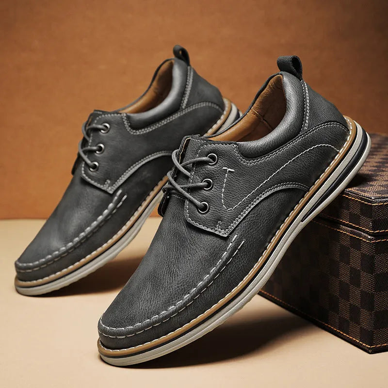 Men's black genuine leather casual lace-up shoes with round toe and low heel on a rubber sole