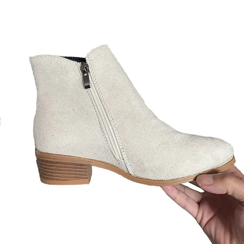 Women’s suede leather ankle boots with side zipper, thick heel, pointed toe, and non-slip sole in beige colour