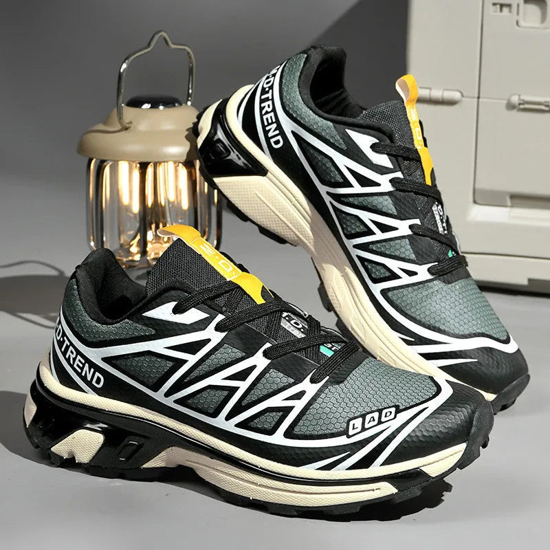 Men's and women's low-top round toe hiking shoes in artificial leather with a lace-up front.