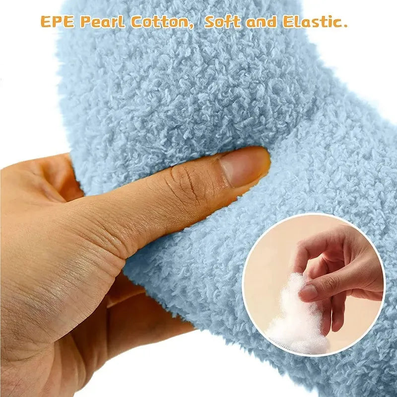 Blue U-shaped plush pet pillow for a small cat or dog on a grey background.