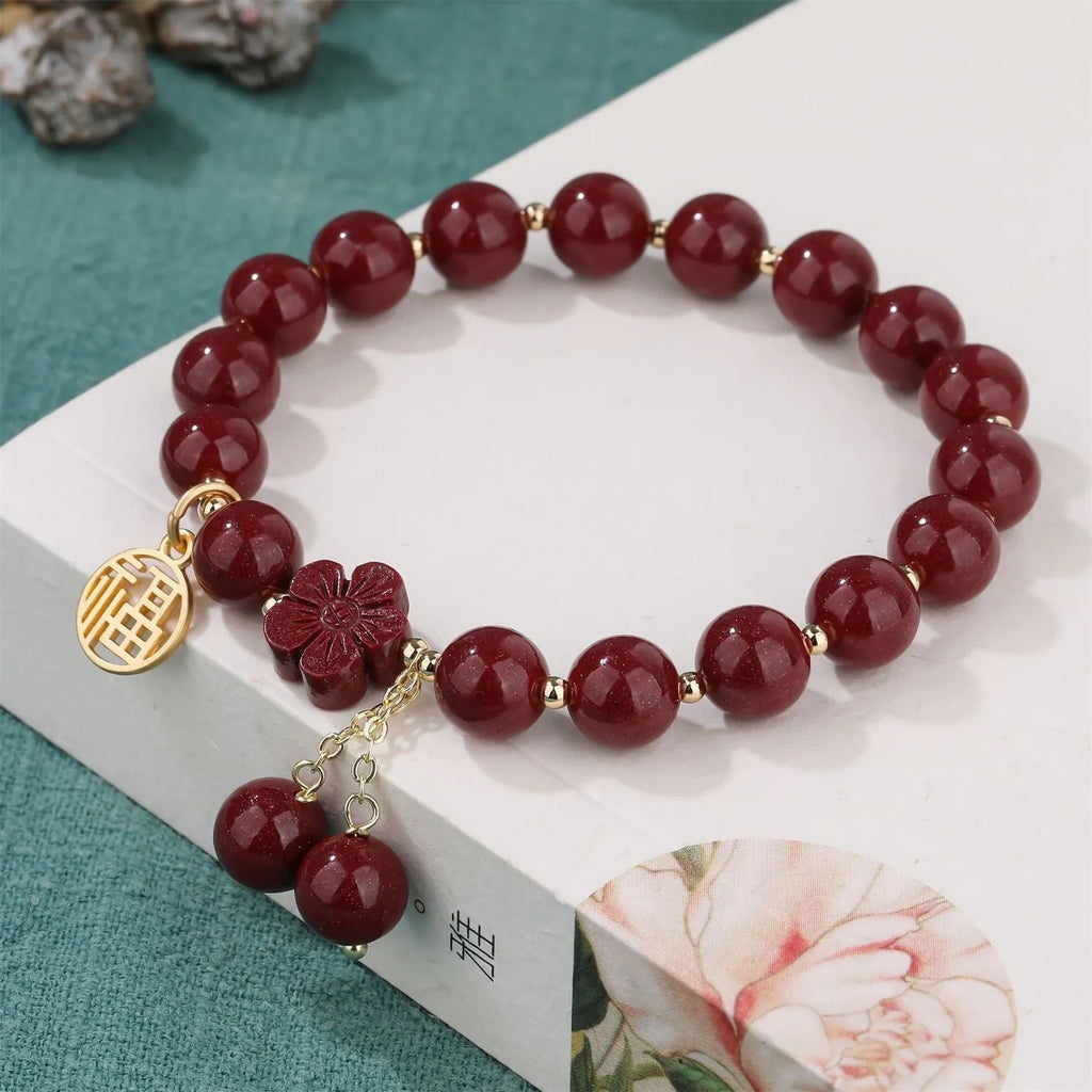 Women's cinnabar bracelet with fu character design and adjustable tassel closure in national style
