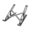 Silver aluminium alloy portable laptop stand with six-gear adjustment folded on a desk