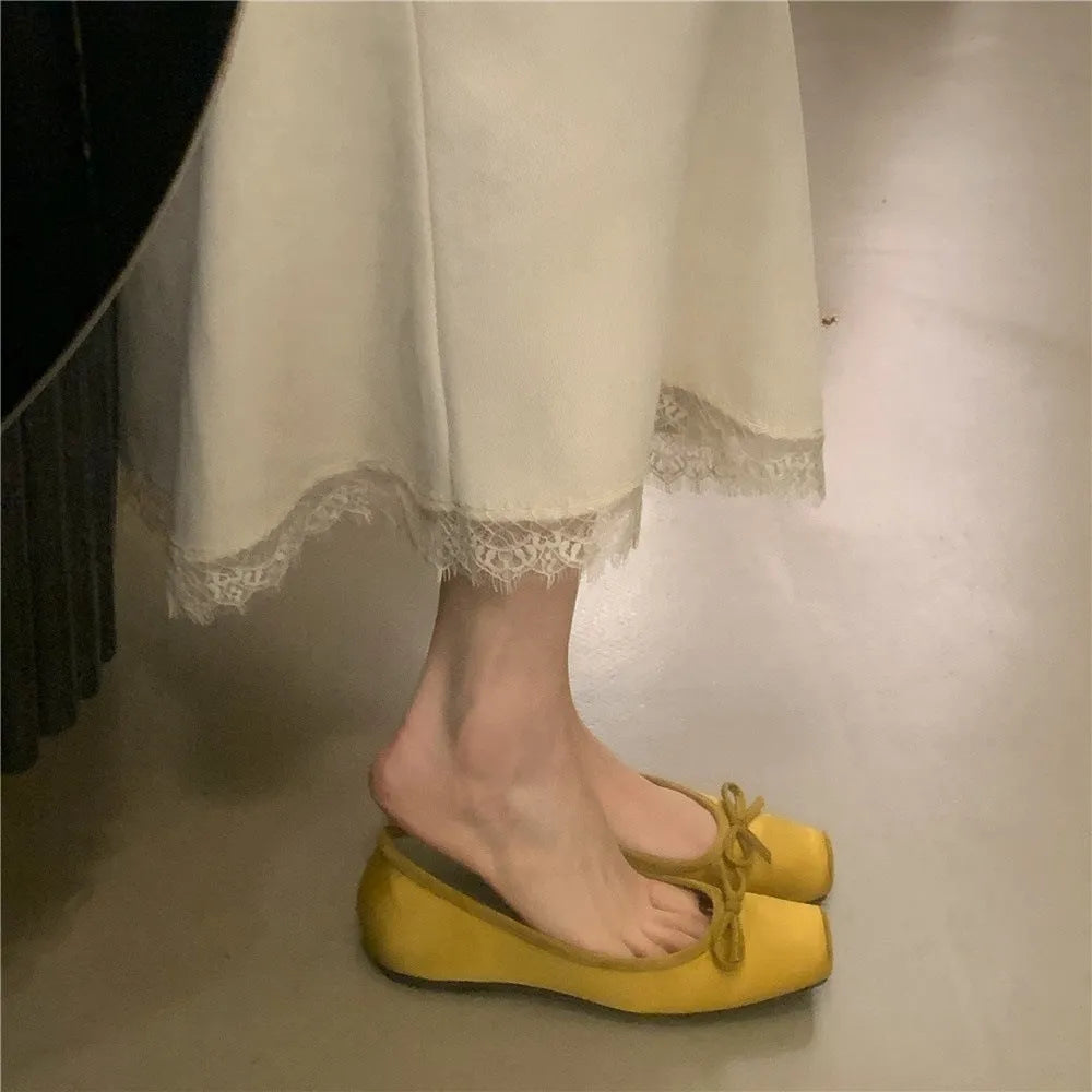 Women's satin shoes with hidden heels, square head and bow detail, available in six solid colours, sizes 35-40.