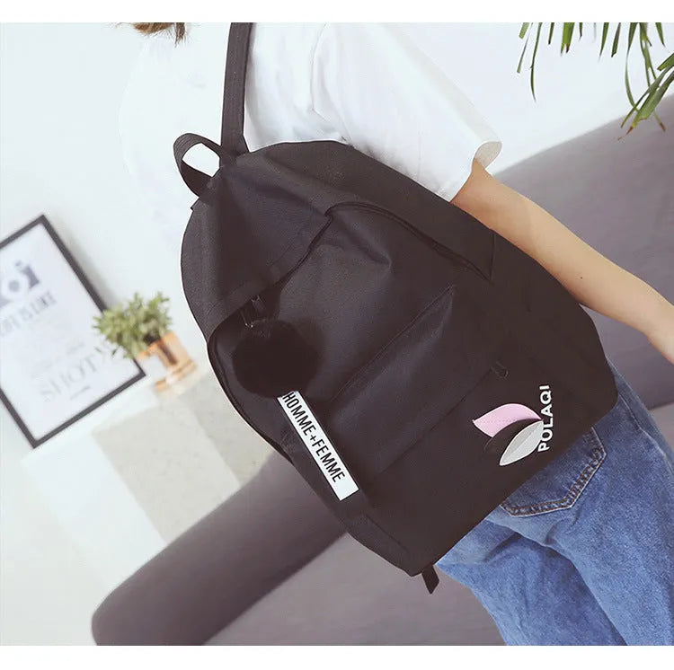 Green canvas college style schoolbag with structured design showing 40cm height and front compartment