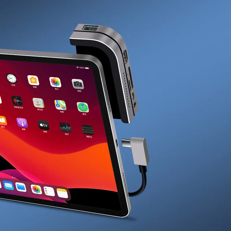 Silver aluminium grey USB-C 6-in-1 docking station for iPad Pro, showing HDMI port and card reader slots.