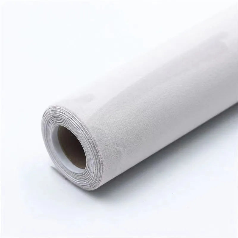 Roll of self-adhesive leather suede in a colour swatch showing multiple options like black, brown, blue, and red.