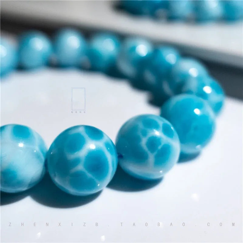 Blue bodhi bracelet with natural sea-pattern crystal stones and pearl accents in Maillard style