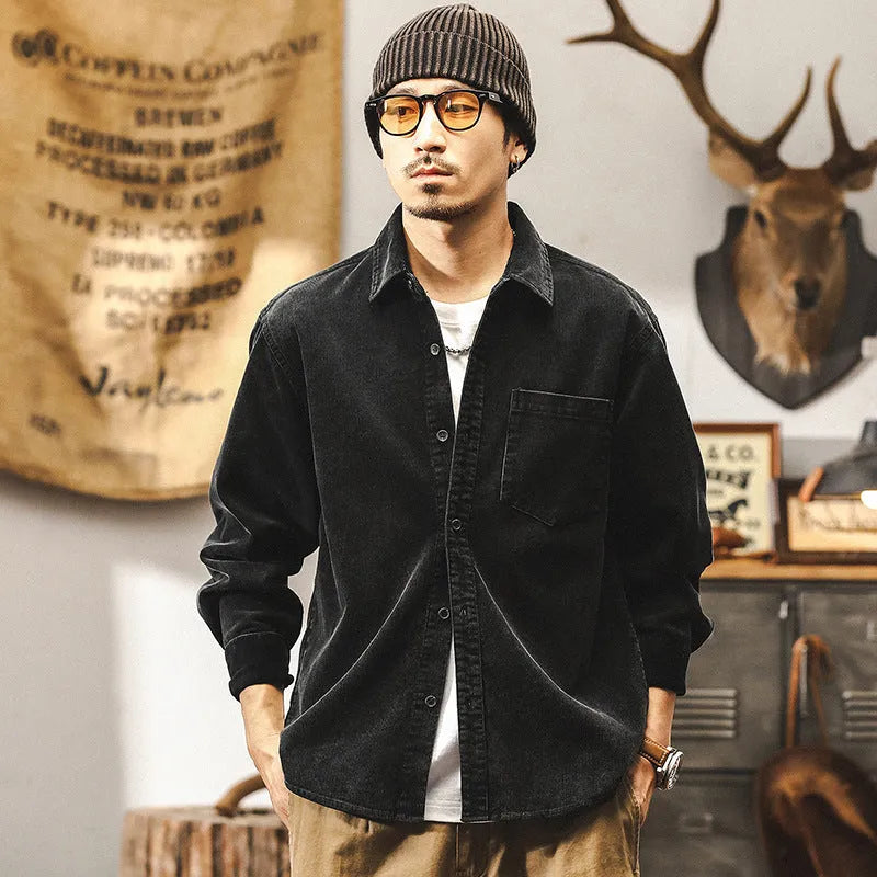 Men's loose-fit long-sleeved corduroy shirt jacket in black or red, showing textured combed cotton fabric.