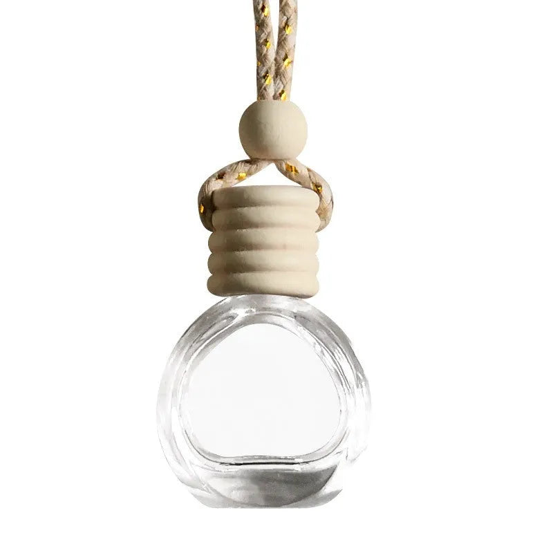 Car empty perfume bottle rearview mirror pendant with colourful rope hanging from car mirror interior