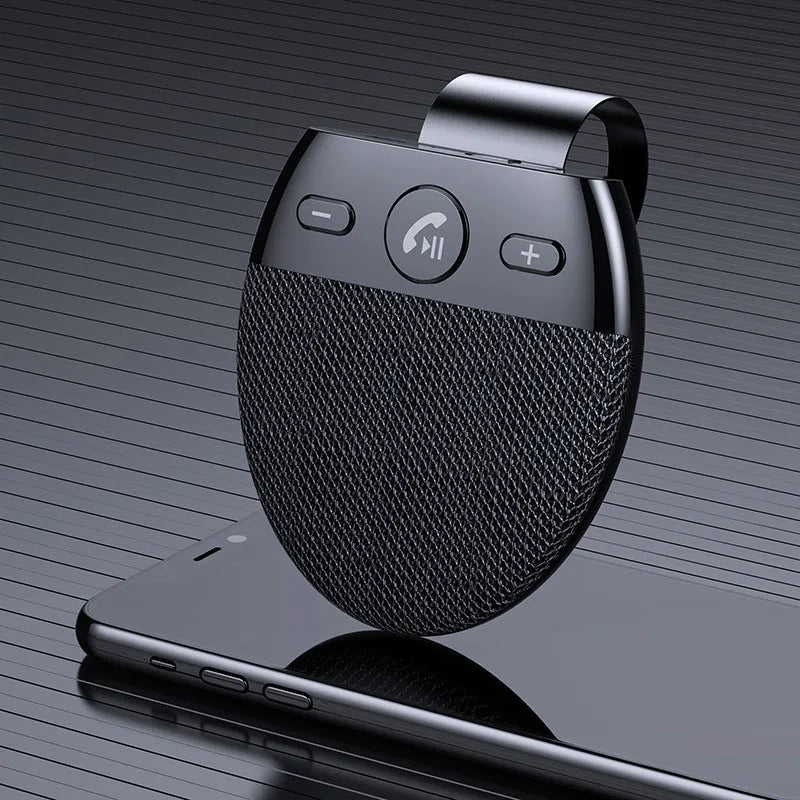 Bluetooth car handsfree device clipped to a car sun visor with black finish